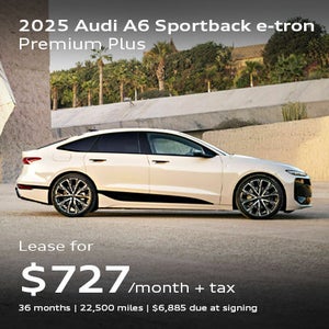 Angled profile of 2025 Audi A6 Sportback e-tron parked